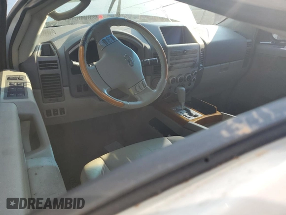 2006 Infiniti QX56 z VIN 5N3AA08A76N810044, wystawiony jako Copart lot #74182384 z przebiegiem Nie podano mil oraz Szkoda całkowita • Salvage title. Historia ofert i sprzedaży dostępna na DreamBid. Obrazek 8.