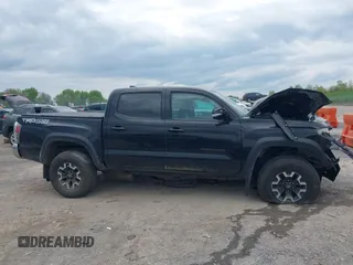 2023 Toyota Tacoma SR with VIN 3TMCZ5AN2PM598464, listed as a IAAI auction lot 42238032 with 35,597 mi miles and . Bid and sale history available at DreamBid. Image 13.
