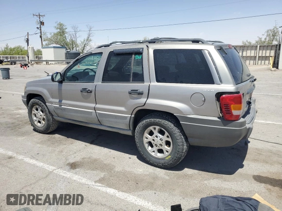 1999 Jeep Grand Cherokee Laredo with VIN 1J4GW58S1XC775877, listed as a Copart auction lot 55639795 with 197,611 mi miles and Salvage title. Bid and sale history available at DreamBid. Image 2.