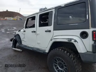 2015 Jeep Wrangler Unlimited Sahara with VIN 1C4BJWEG5FL518191, listed as a IAAI auction lot 41914581 with 107,433 mi miles. Bid and sale history available at carsss.com. Image 18.