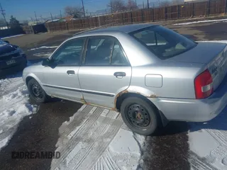 2002 Mazda Protege DX with VIN JM1BJ225321588015, listed as a IAAI auction lot 41409015 with 170,815 mi miles and . Bid and sale history available at DreamBid. Image 6.