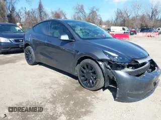 2023 Tesla Model Y Long Range with VIN 7SAYGDEE2PF883687, listed as a IAAI auction lot 41589837 with 36,890 mi miles. Bid and sale history available at carsss.com. Image 1.