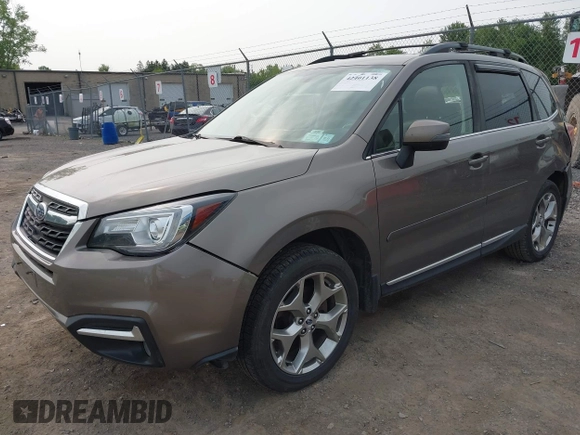 2017 Subaru Forester Touring z VIN JF2SJAWC6HH529707, wystawiony jako IAAI lot #42401138 z przebiegiem 172 868 mil mil oraz . Historia ofert i sprzedaży dostępna na DreamBid. Obrazek 17.