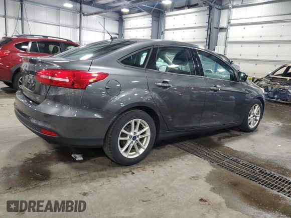 2017 Ford Focus SE with VIN 1FADP3F21HL205754, listed as a Copart auction lot 63632985 with 96,797 mi miles and Salvage title. Bid and sale history available at DreamBid. Image 3.