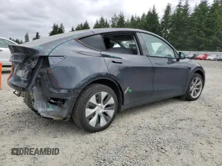 2024 Tesla Model Y Long Range with VIN 7SAYGDEE9RF069801, listed as a Copart auction lot 60857145 with 18,808 mi miles and Salvage title. Bid and sale history available at DreamBid. Image 3.