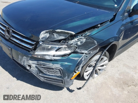 2018 Volkswagen Tiguan S with VIN 3VV1B7AX1JM165641, listed as a IAAI auction lot 42699622 with 75,354 mi miles and . Bid and sale history available at DreamBid. Image 6.