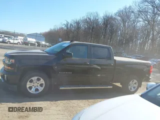 2018 Chevrolet Silverado 1500 LT with VIN 1GCUKREC3JF119906, listed as a IAAI auction lot 41765398 with 122,472 mi miles and . Bid and sale history available at DreamBid. Image 14.