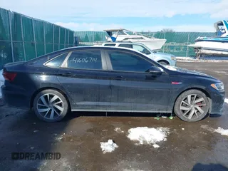 2019 Volkswagen Jetta GLI S z VIN 3VW6T7BU5KM240619, wystawiony jako IAAI lot #41606714 z przebiegiem 86 557 mil mil oraz . Historia ofert i sprzedaży dostępna na DreamBid. Obrazek 13.