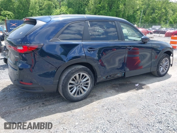 2024 Mazda CX-90 Select z VIN JM3KKAHD4R1142933, wystawiony jako IAAI lot #42269979 z przebiegiem 30 373 mil mil oraz . Historia ofert i sprzedaży dostępna na DreamBid. Obrazek 4.