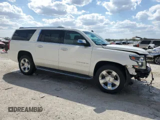 2015 Chevrolet Suburban LTZ with VIN 1GNSKKKC6FR119849, listed as a Copart auction lot 47176815 with 67,235 mi miles and Salvage Title. Bid and sale history available at carsss.com. Image 4.