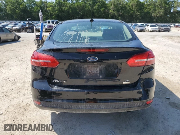 2018 Ford Focus SE z VIN 1FADP3FEXJL256542, wystawiony jako Copart lot #54583915 z przebiegiem 107 774 mil mil oraz Szkoda całkowita • Salvage title. Historia ofert i sprzedaży dostępna na DreamBid. Obrazek 6.