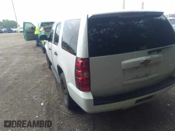 2013 Chevrolet Tahoe Commercial with VIN 1GNLC2E05DR351035, listed as a IAAI auction lot 42641974 with 265,608 mi miles and . Bid and sale history available at DreamBid. Image 3.