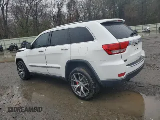 2013 Jeep Grand Cherokee Overland with VIN 1C4RJECT2DC590911, listed as a Copart auction lot 42939405 with 136,673 mi miles and Salvage Title. Bid and sale history available at carsss.com. Image 2.