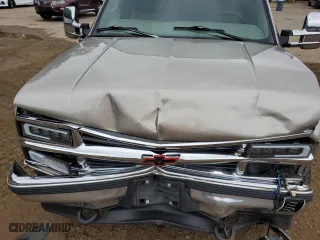 1999 Chevrolet Suburban with VIN 1GNGK26J0XJ439859, listed as a Copart auction lot 69076004 with 277,201 mi miles and Salvage Title. Bid and sale history available at carsss.com. Image 13.