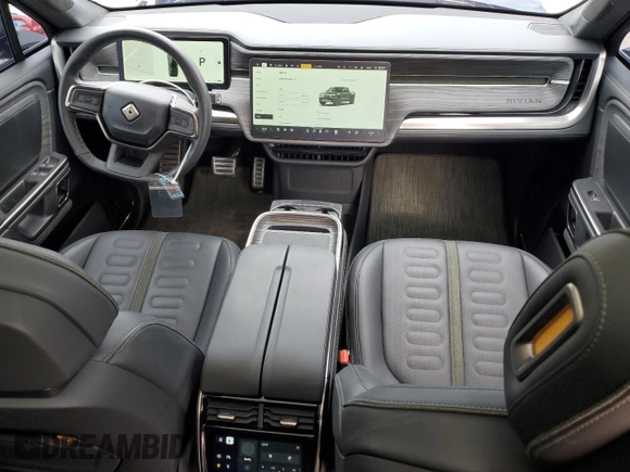 2023 Rivian R1T Adventure z VIN 7FCTGAAA8PN001040, wystawiony jako Copart lot #71517874 z przebiegiem 19 789 mil mil oraz Szkoda całkowita • Salvage title. Historia ofert i sprzedaży dostępna na DreamBid. Obrazek 8.