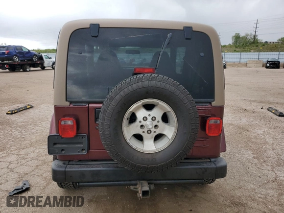 2002 Jeep Wrangler Sahara with VIN 1J4FA59S32P746410, listed as a Copart auction lot 56403075 with 147,968 mi miles and Salvage title. Bid and sale history available at DreamBid. Image 6.
