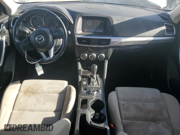 2016 Mazda CX-5 Touring z VIN JM3KE2CYXG0683673, wystawiony jako Copart lot #56724025 z przebiegiem 107 293 mil mil oraz Szkoda całkowita • Salvage title. Historia ofert i sprzedaży dostępna na DreamBid. Obrazek 8.