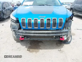 2018 Jeep Cherokee Trailhawk with VIN 1C4PJMBX6JD569684, listed as a IAAI auction lot 41925325 with 149,446 mi miles and . Bid and sale history available at DreamBid. Image 6.