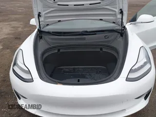 2020 Tesla Model 3 Standard Range Plus with VIN 5YJ3E1EA7LF659172, listed as a IAAI auction lot 42017026 with 32,104 mi miles. Bid and sale history available at carsss.com. Image 10.