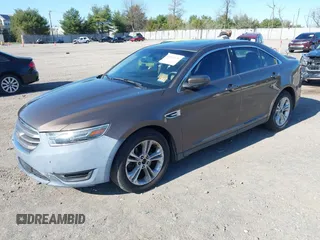 2015 Ford Taurus SEL with VIN 1FAHP2E83FG206055, listed as a IAAI auction lot 41943670 with 90,808 mi miles and . Bid and sale history available at carsss.com. Image 2.