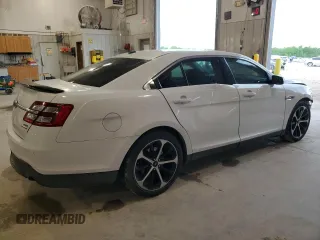 2014 Ford Taurus SEL z VIN 1FAHP2E89EG121025, wystawiony jako Copart lot #55405535 z przebiegiem 168 004 mil mil oraz Czysty tytuł • Clean title. Historia ofert i sprzedaży dostępna na DreamBid. Obrazek 3.