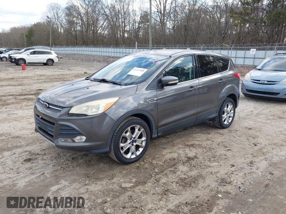 2013 Ford Escape SEL with VIN 1FMCU0HX8DUD68360, listed as a IAAI auction lot 41427968 with 129,067 mi miles. Bid and sale history available at carsss.com. Image 2.
