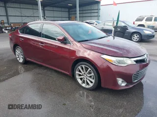 2014 Toyota Avalon Limited with VIN 4T1BK1EB3EU113035, listed as a IAAI auction lot 42040239 with 118,609 mi miles. Bid and sale history available at carsss.com. Image 1.