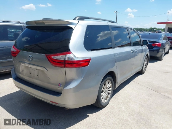2015 Toyota Sienna XLE with VIN 5TDYK3DC0FS555636, listed as a IAAI auction lot 42099577 with 114,975 mi miles. Bid and sale history available at carsss.com. Image 4.