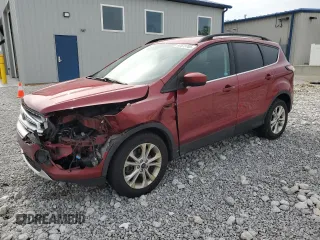 2018 Ford Escape SE z VIN 1FMCU9GD3JUC00634, wystawiony jako Copart lot #57573765 z przebiegiem 74 035 mil mil oraz Szkoda całkowita • Salvage title. Historia ofert i sprzedaży dostępna na DreamBid. Obrazek 1.