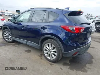 2014 Mazda CX-5 Grand Touring with VIN JM3KE2DY1E0307911, listed as a IAAI auction lot 42064898 with 133,934 mi miles. Bid and sale history available at carsss.com. Image 3.