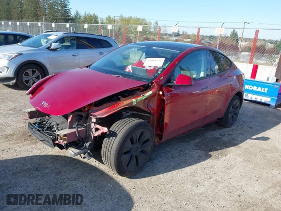 2024 Tesla Model Y Long Range with VIN 7SAYGDEE9RF199805, listed as a IAAI auction lot 42018221 with 7,359 mi miles. Bid and sale history available at carsss.com. Image 2.