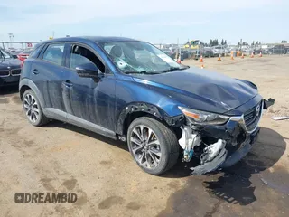 2019 Mazda CX-3 Touring z VIN JM1DKFC78K1416219, wystawiony jako IAAI lot #41761329 z przebiegiem 52 172 mil mil oraz . Historia ofert i sprzedaży dostępna na DreamBid. Obrazek 1.