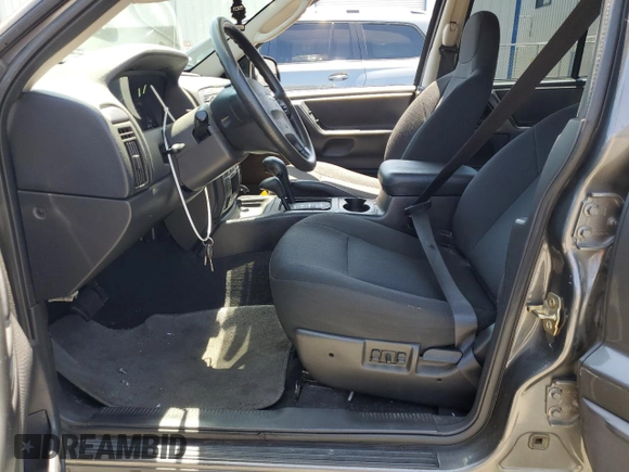 2004 Jeep Grand Cherokee Laredo with VIN 1J4GW48S54C430857, listed as a Copart auction lot 62744305 with 122,099 mi miles and Salvage title. Bid and sale history available at DreamBid. Image 7.