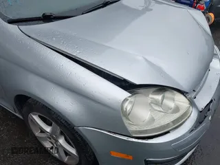 2009 Volkswagen Jetta S z VIN 3VWJZ71K29M148712, wystawiony jako IAAI lot #41724523 z przebiegiem 112 043 mil mil oraz . Historia ofert i sprzedaży dostępna na DreamBid. Obrazek 13.