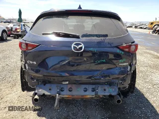 2020 Mazda CX-5 Grand Touring z VIN JM3KFADM4L0794765, wystawiony jako Copart lot #63850005 z przebiegiem 53 270 mil mil oraz Szkoda całkowita • Salvage title. Historia ofert i sprzedaży dostępna na DreamBid. Obrazek 6.