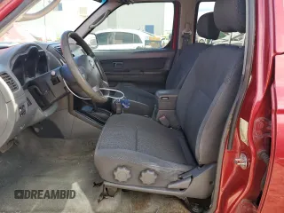 2003 Nissan Frontier XE with VIN 1N6ED27T13C409632, listed as a Copart auction lot 84884434 with 194,167 mi miles and Salvage title. Bid and sale history available at DreamBid. Image 7.