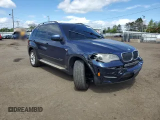 2012 BMW X5 35i with VIN 5UXZV4C56CL754643, listed as a Copart auction lot 55970125 with 150,584 mi miles and Salvage title. Bid and sale history available at DreamBid. Image 4.