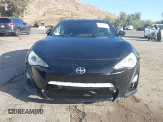 2015 Scion FR-S z VIN JF1ZNAA14F9703780, wystawiony jako IAAI lot #41493648 z przebiegiem 125 997 mil mil oraz . Historia ofert i sprzedaży dostępna na DreamBid. Obrazek 13.