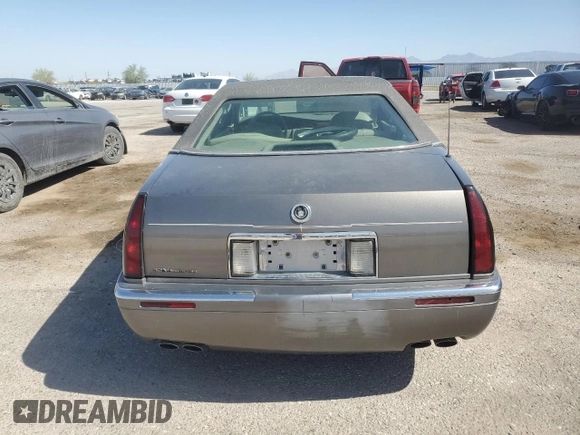 1998 Cadillac Eldorado z VIN 1G6EL12YXWU610918, wystawiony jako Copart lot #57309075 z przebiegiem 168 228 mil mil oraz Szkoda całkowita • Salvage title. Historia ofert i sprzedaży dostępna na DreamBid. Obrazek 6.