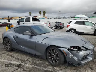 2021 Toyota GR Supra 2.0 with VIN WZ1DB2C04MW043408, listed as a Copart auction lot 49366794 with 33,453 mi miles and Salvage Title. Bid and sale history available at carsss.com. Image 4.