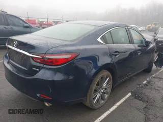 2021 Mazda 6 Touring with VIN JM1GL1VM4M1616243, listed as a IAAI auction lot 41907100 with 59,315 mi miles and . Bid and sale history available at carsss.com. Image 4.