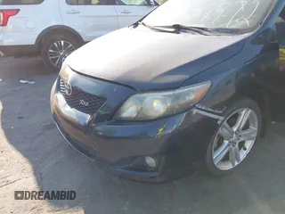 2009 Toyota Corolla XRS with VIN 1NXBE40E59Z003796, listed as a IAAI auction lot 42077772 with 215,159 mi miles. Bid and sale history available at carsss.com. Image 6.