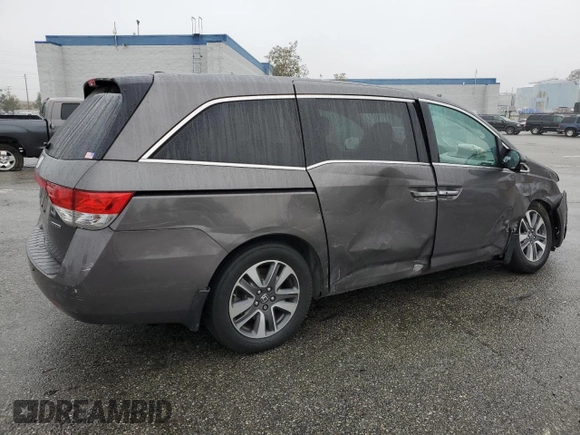 2016 Honda Odyssey Touring Elite with VIN 5FNRL5H97GB090094, listed as a Copart auction lot 50545285 with 158,334 mi miles and Salvage Title. Bid and sale history available at DreamBid. Image 3.