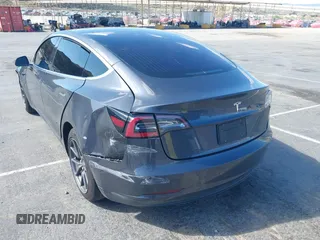 2019 Tesla Model 3 Mid Range with VIN 5YJ3E1EA6KF307456, listed as a IAAI auction lot 41944454 with 99,059 mi miles and . Bid and sale history available at DreamBid. Image 3.