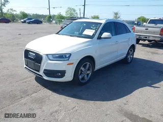 2015 Audi Q3 2.0T Premium Plus with VIN WA1EFCFS7FR010697, listed as a IAAI auction lot 41948566 with 167,001 mi miles. Bid and sale history available at carsss.com. Image 2.