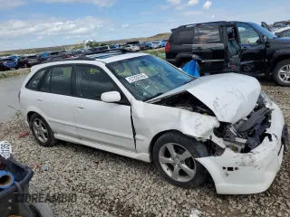 2002 Mazda Protege z VIN JM1BJ245721470434, wystawiony jako Copart lot #57293765 z przebiegiem 144 622 mil mil oraz Szkoda całkowita • Salvage title. Historia ofert i sprzedaży dostępna na DreamBid. Obrazek 4.
