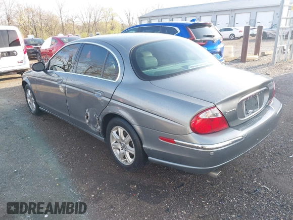 2003 Jaguar S-Type with VIN SAJEA01T23FM93839, listed as a IAAI auction lot 41891973 with 153,761 mi miles and . Bid and sale history available at DreamBid. Image 3.