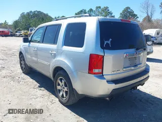 2011 Honda Pilot Touring with VIN 5FNYF4H91BB086712, listed as a IAAI auction lot 41809369 with 260,718 mi miles. Bid and sale history available at carsss.com. Image 3.