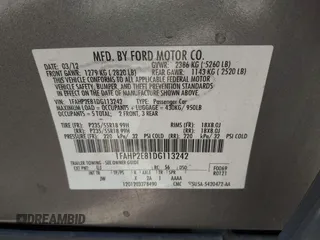 2013 Ford Taurus SEL with VIN 1FAHP2E81DG113242, listed as a IAAI auction lot 41952486 with 169,369 mi miles. Bid and sale history available at carsss.com. Image 9.