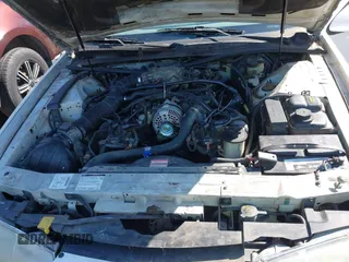 1996 Ford Thunderbird LX with VIN 1FALP62W8TH128351, listed as a IAAI auction lot 41730676 with 166,550 mi miles. Bid and sale history available at carsss.com. Image 10.